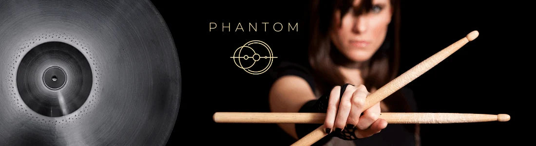 Drum cymbal with 'Phantom' branding and a person holding drumsticks on a black background